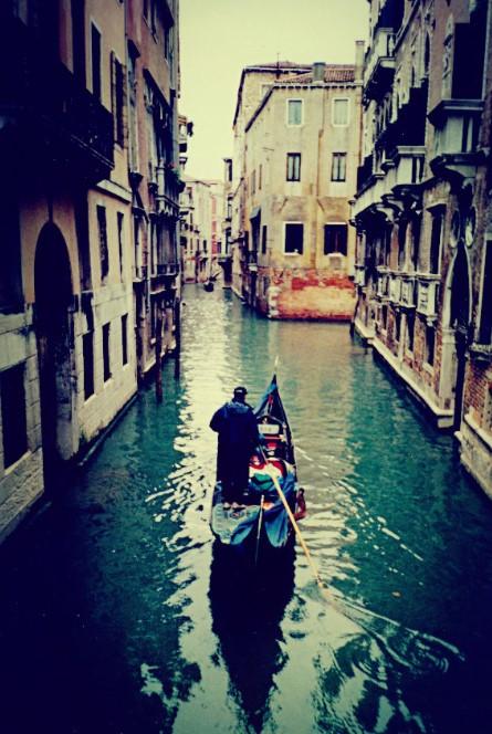 A gondola going through Venice